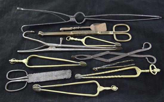 A collection of assorted George III and later tongs and nips, largest 21in.